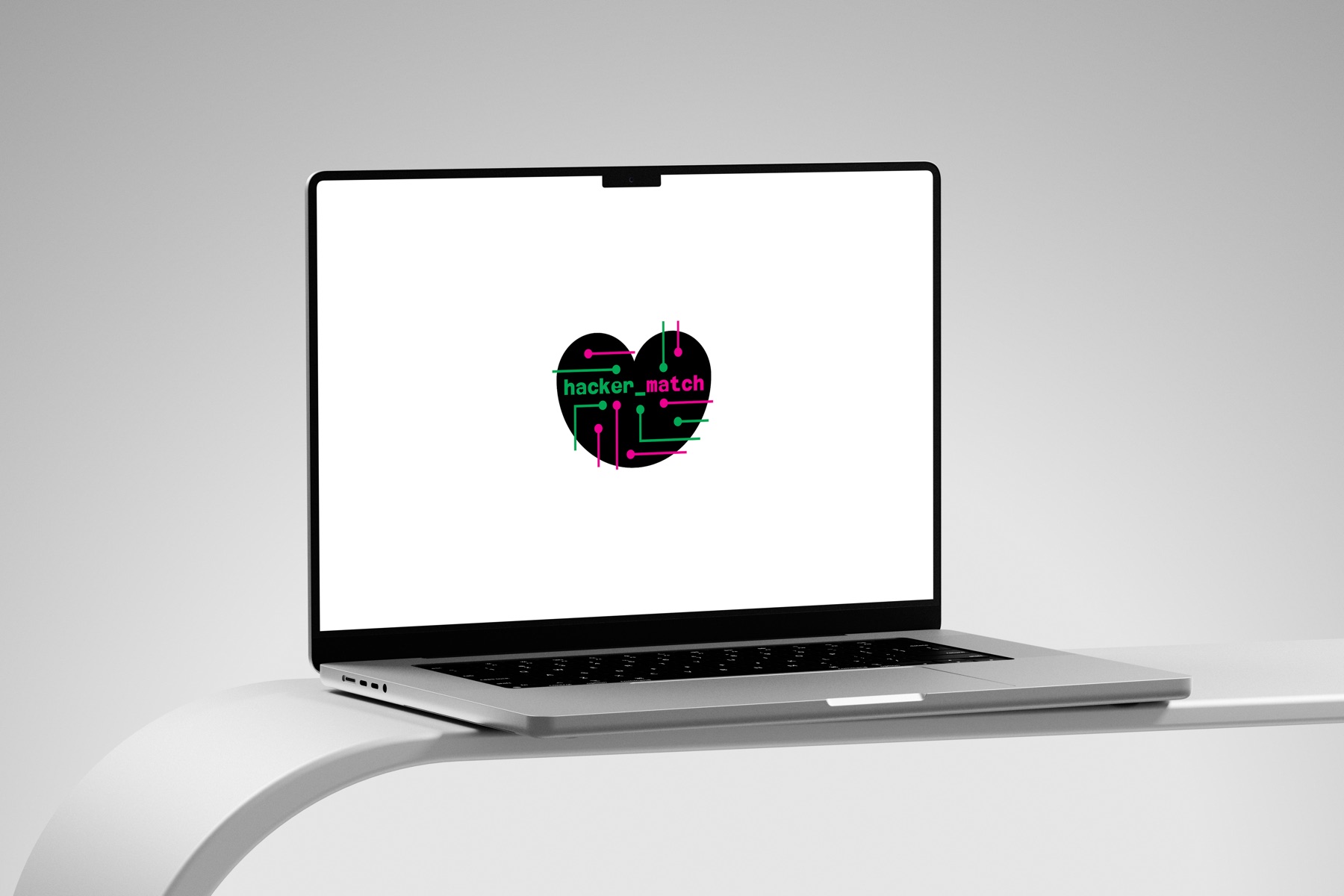 A laptop showing the hacker_match title screen with a pixel-heart mark